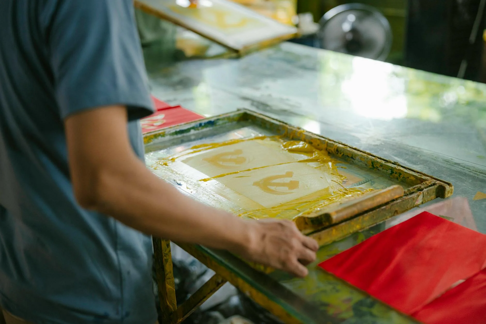 5 Types of T-Shirt Printing Methods https://www.pexels.com/photo/a-man-is-working-on-a-screen-printing-machine-27893067/